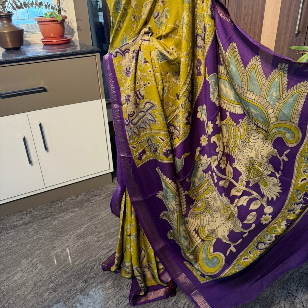 Purple border detail on lemon green viscose georgette saree