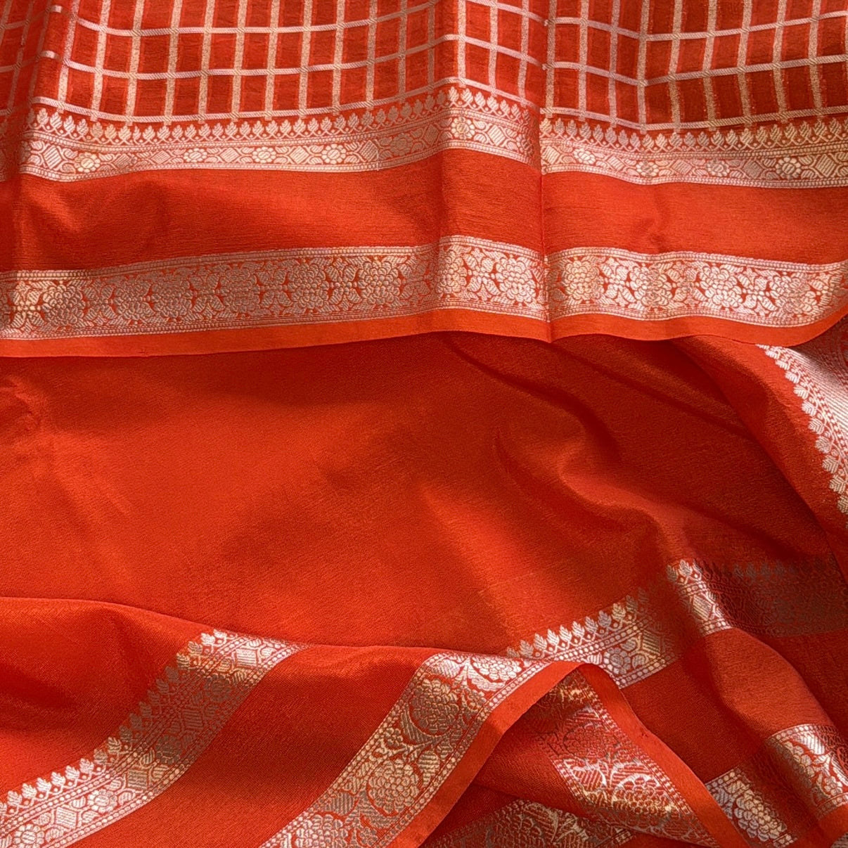 nt Orange Plain Raw Silk Saree Checked Blouse