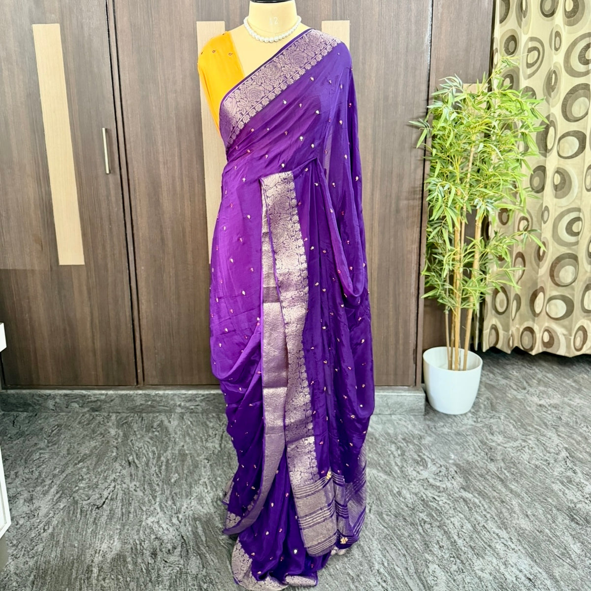 Purple chinnon saree with mirror embroidery and embroidered pallu for evening parties