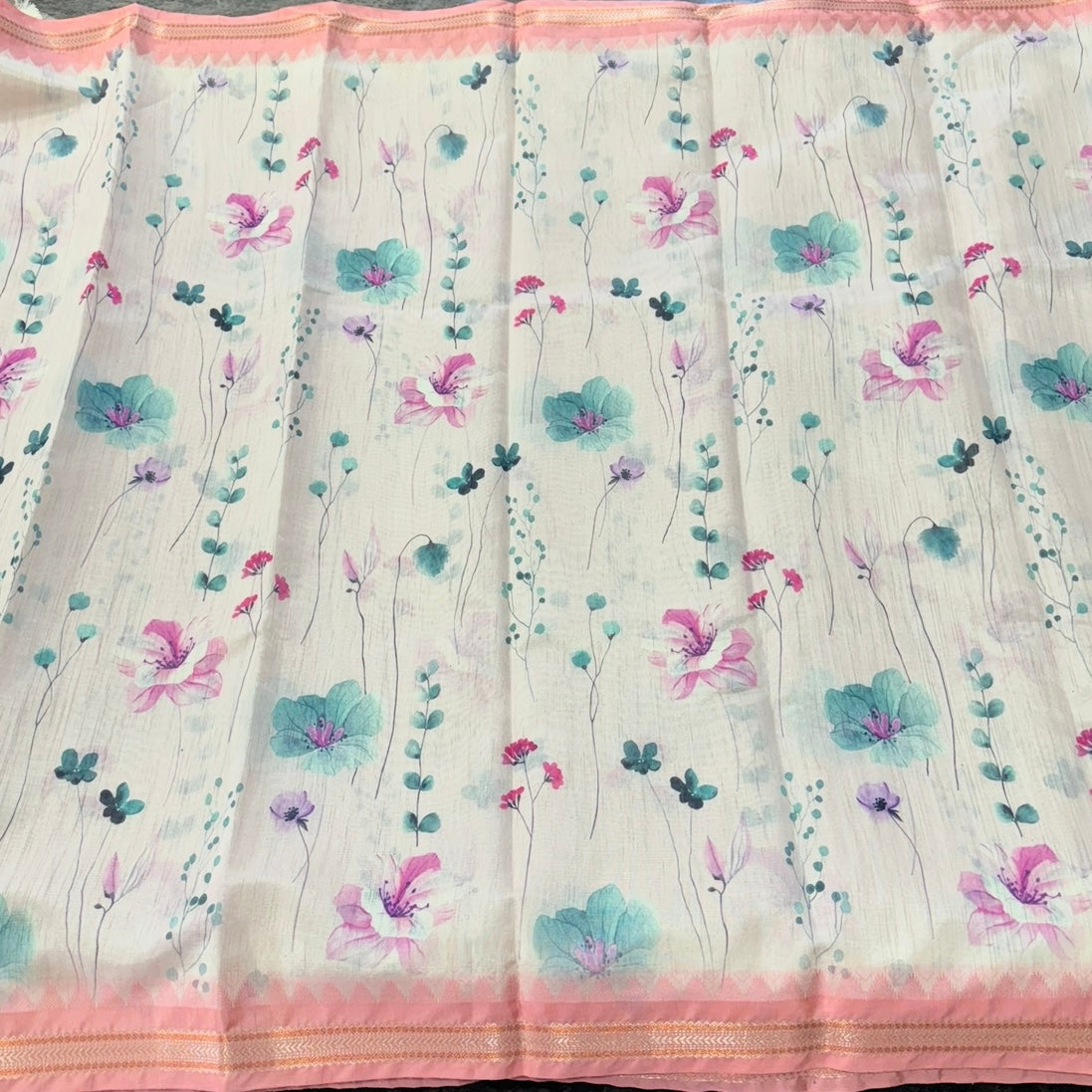 Ivory tissue linen saree with silver zari stripes and peach-pink printed florals