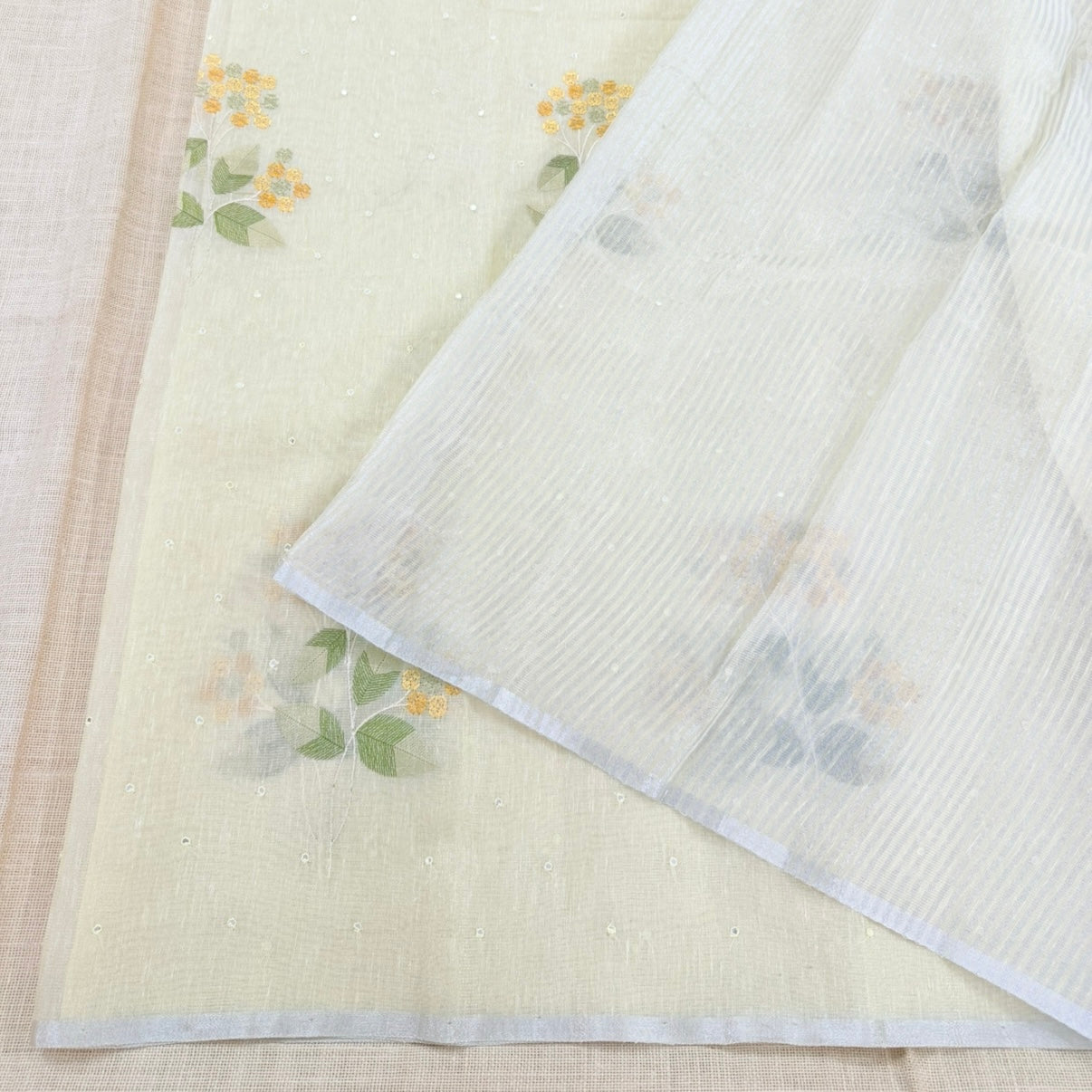 Pastel Yellow Floral Embroidery Tissue Linen Saree