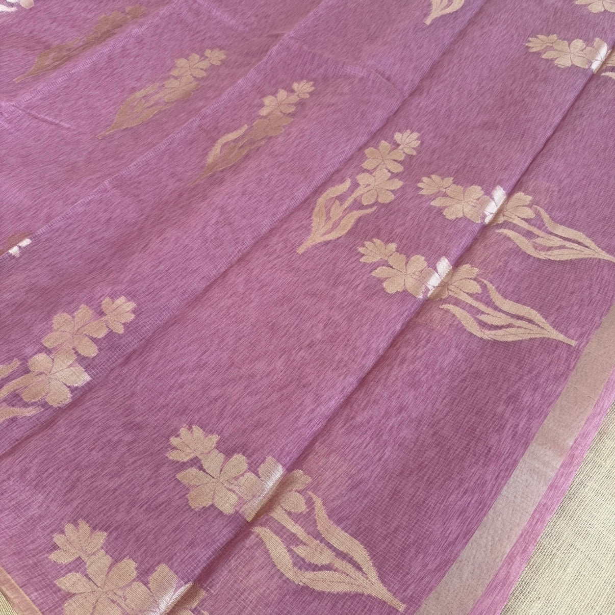 Onion pink paper silk saree with fine zari lines and floral zari weaving