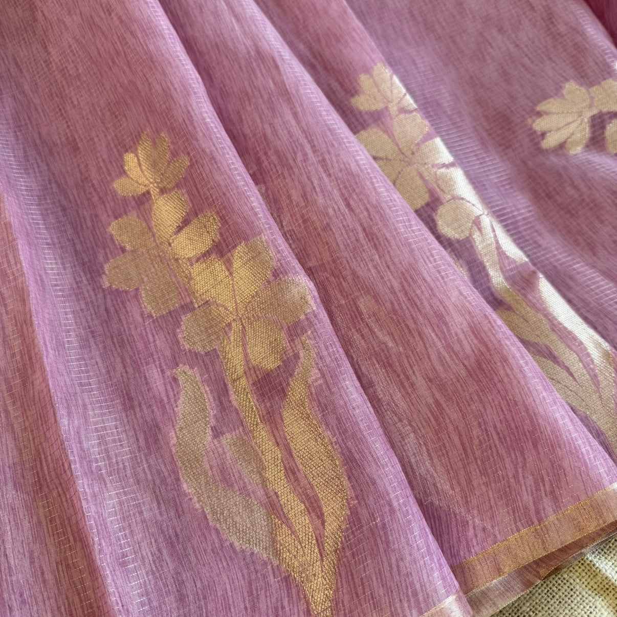 Onion pink paper silk saree with fine zari lines and floral zari weaving