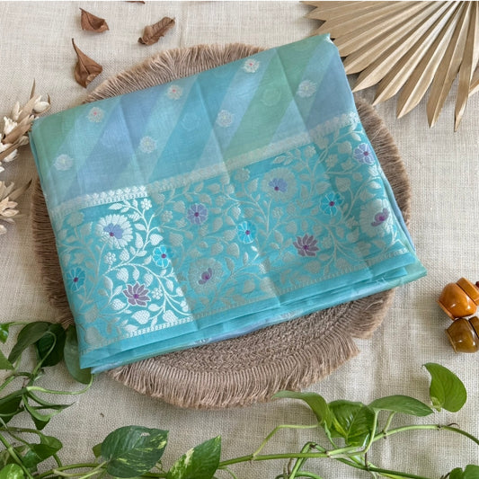 Soft pastel aqua saree with elegant silver zari floral border