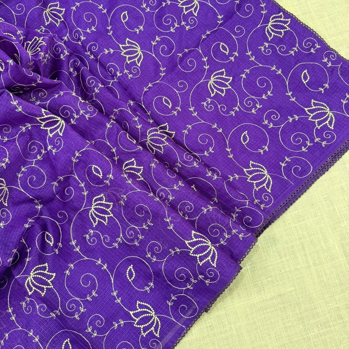 Purple Kota cotton saree showing woven checked body and scallop border