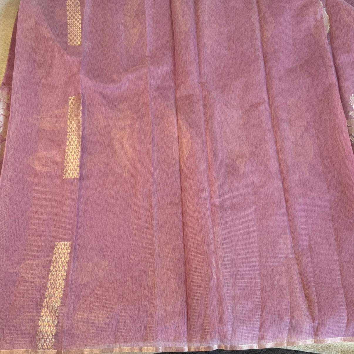 Onion pink paper silk saree with fine zari lines and floral zari weaving