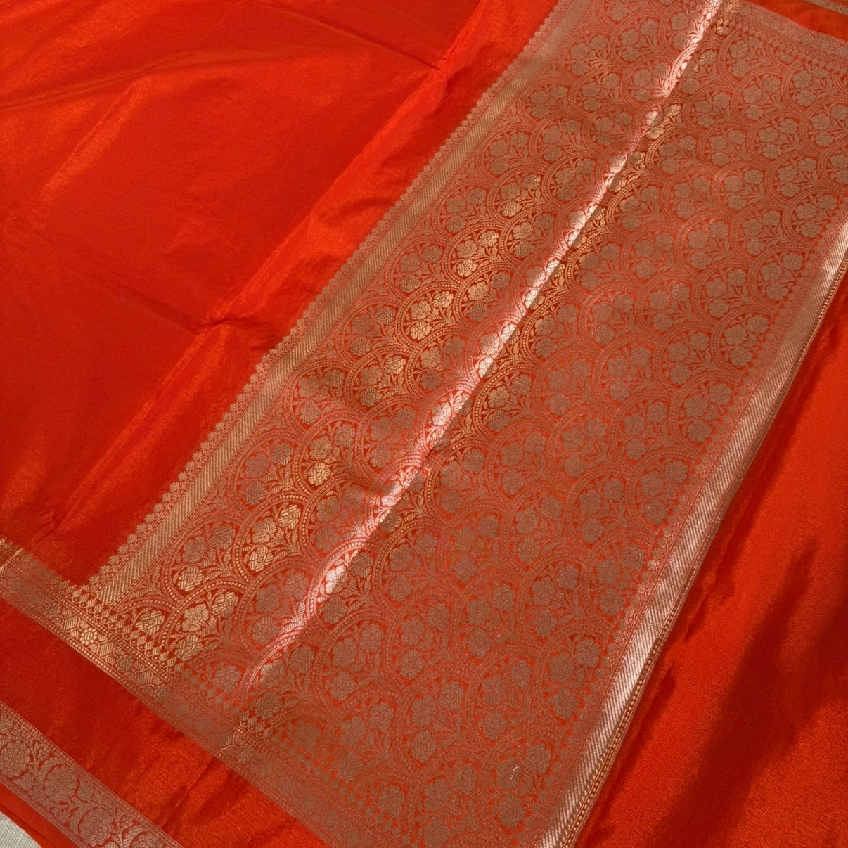 nt Orange Plain Raw Silk Saree Checked Blouse