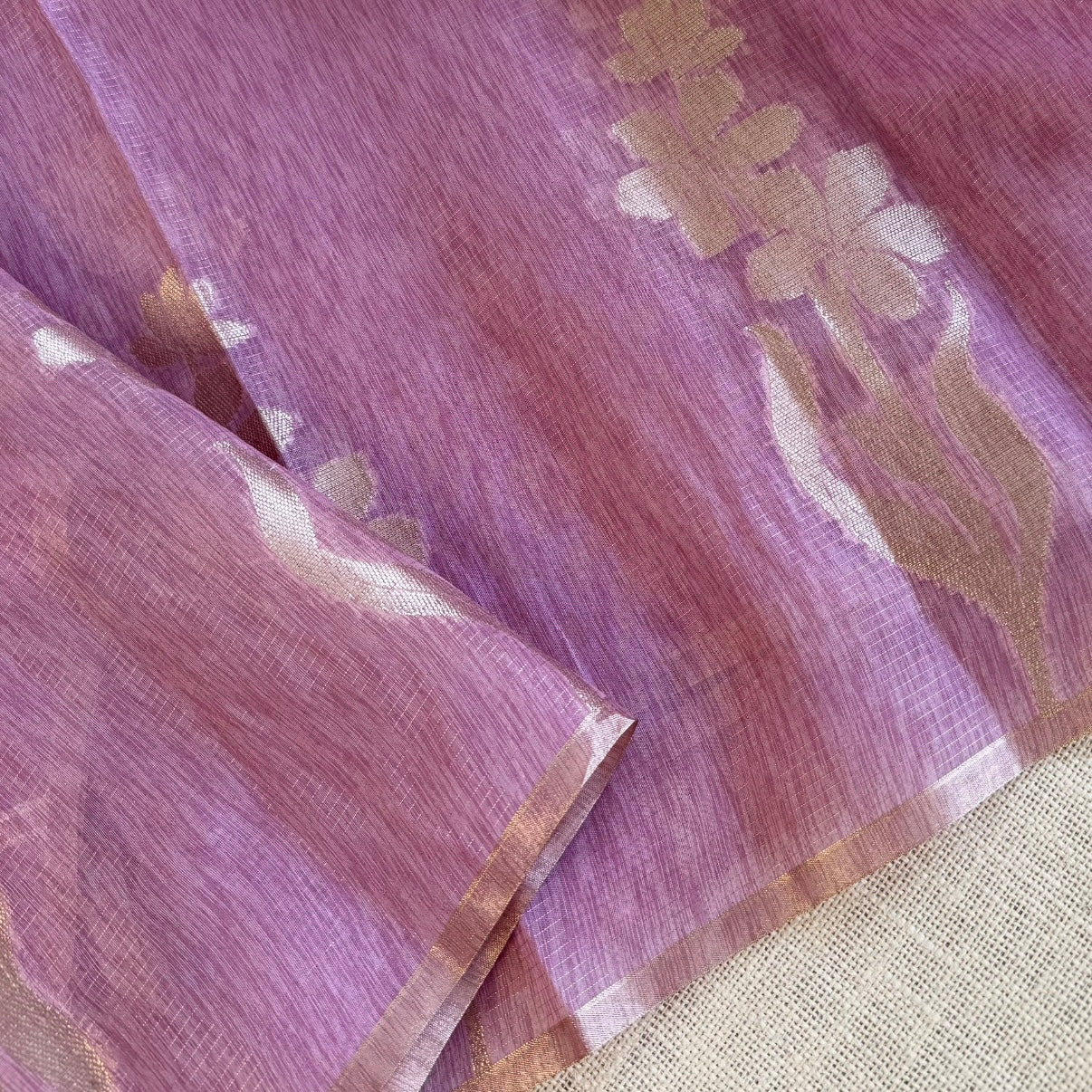 Onion pink paper silk saree with fine zari lines and floral zari weaving
