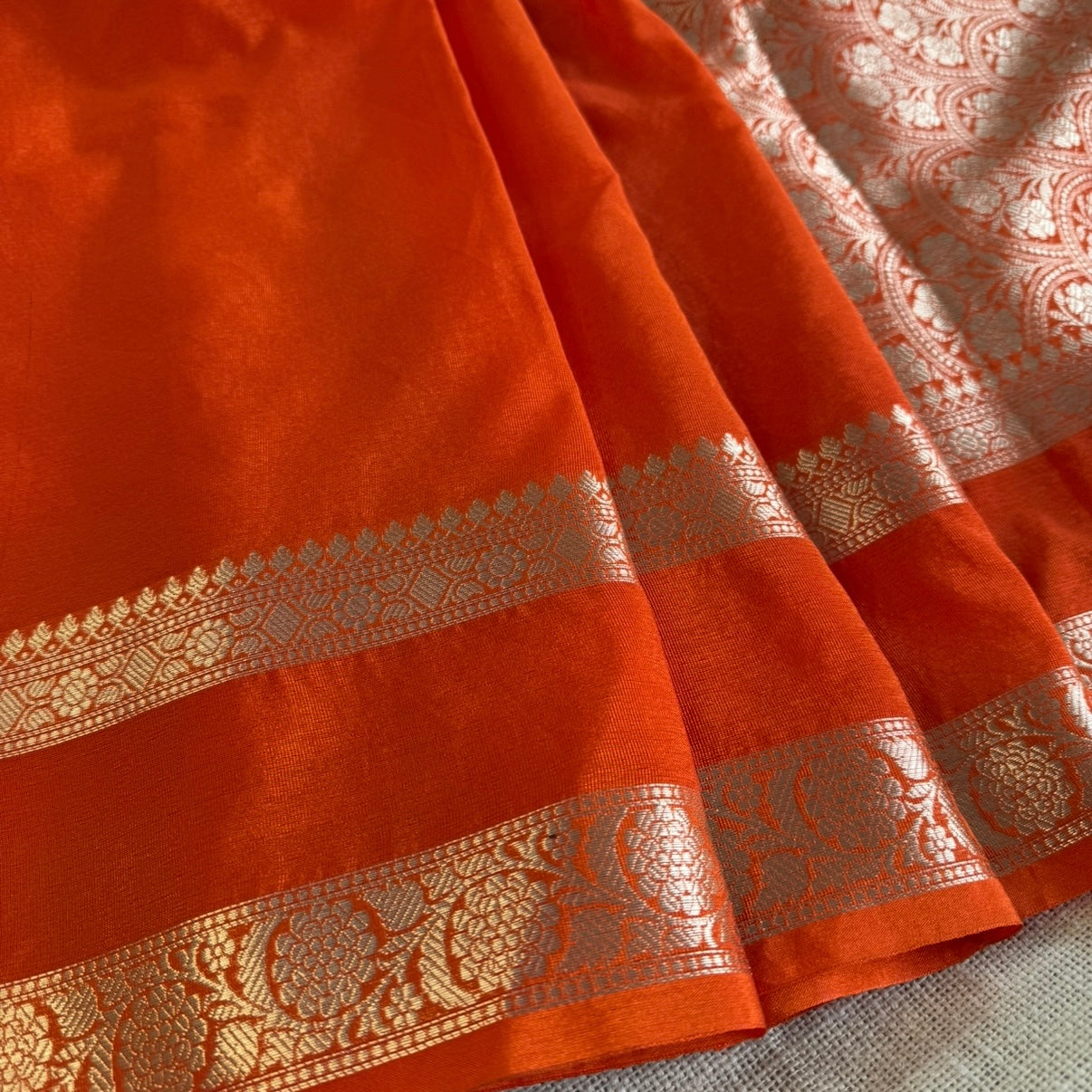 nt Orange Plain Raw Silk Saree Checked Blouse