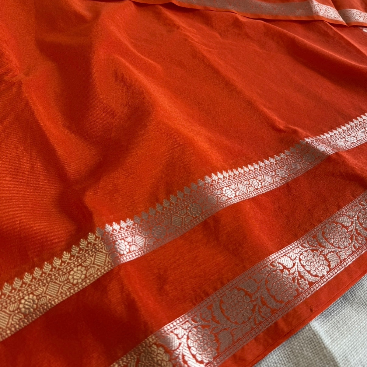 nt Orange Plain Raw Silk Saree Checked Blouse