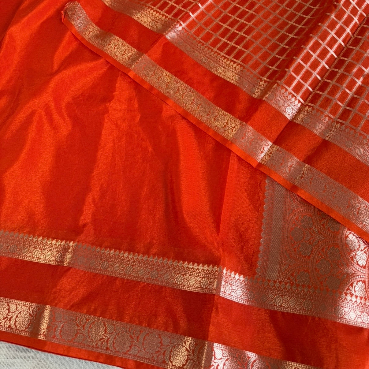 nt Orange Plain Raw Silk Saree Checked Blouse