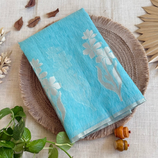 Sky blue paper silk saree with fine zari lines and floral zari weaving