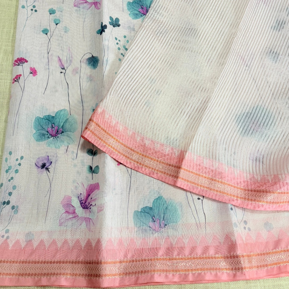 Silver zari striped ivory tissue linen saree with soft floral print