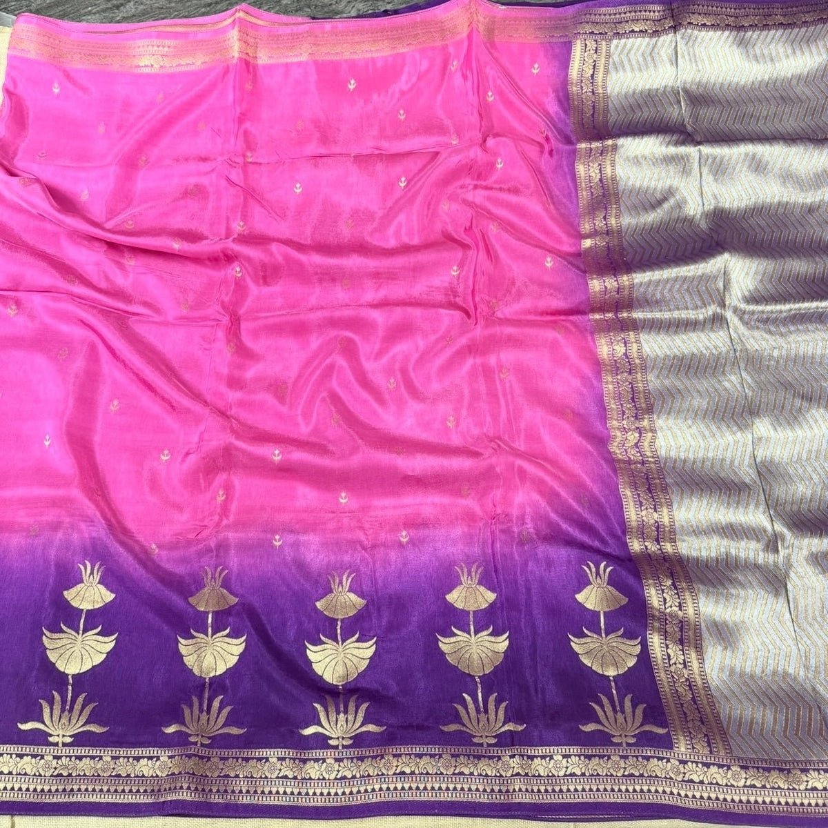 Purple pallu of pink pure crepe silk saree with zari florals