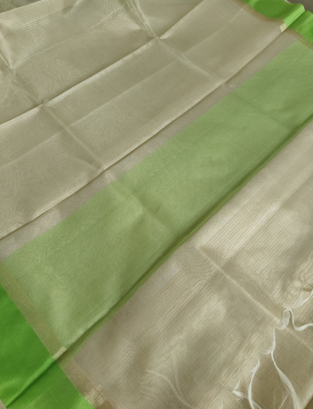 Ivory Tissue Parrot Green Border Saree
