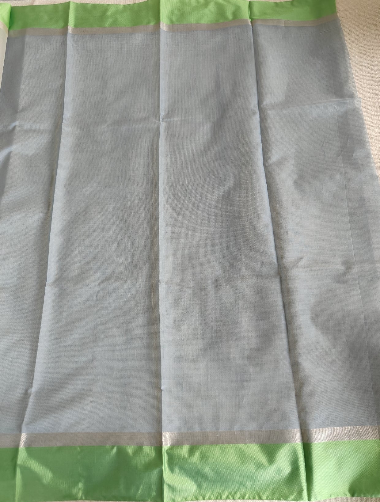 Ivory Tissue Parrot Green Border Saree