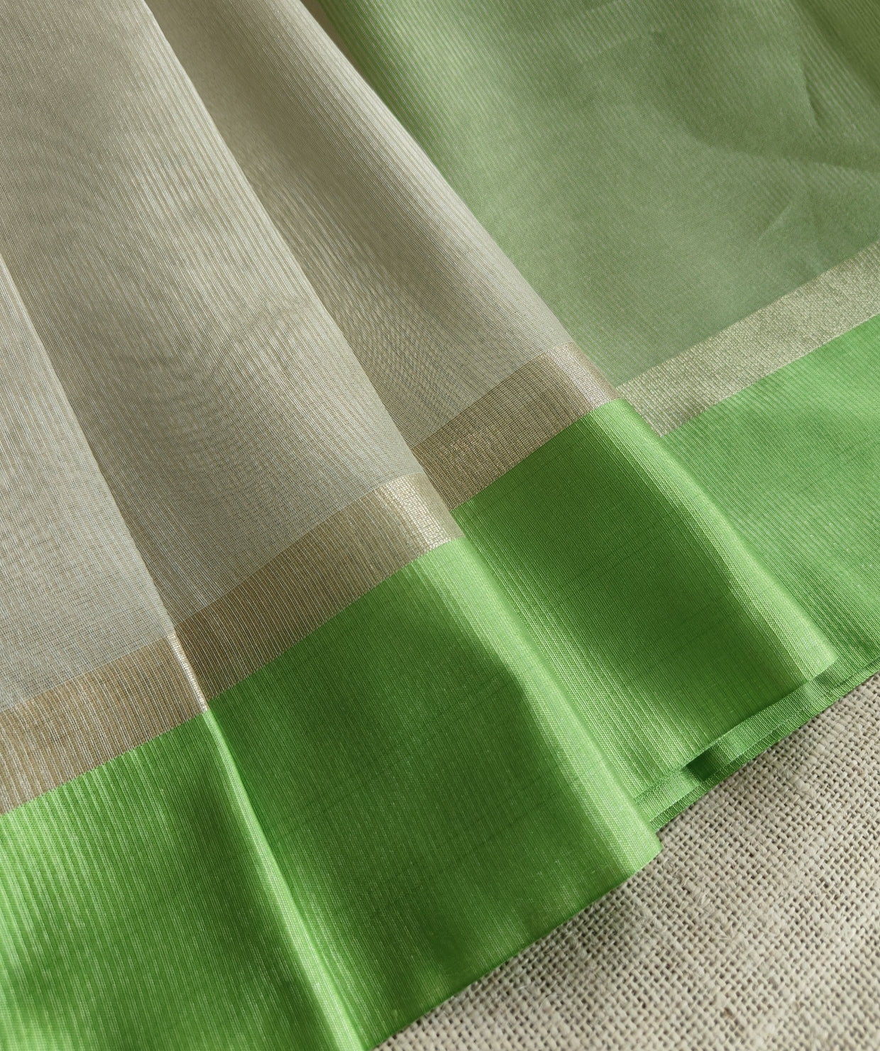 Ivory Tissue Parrot Green Border Saree