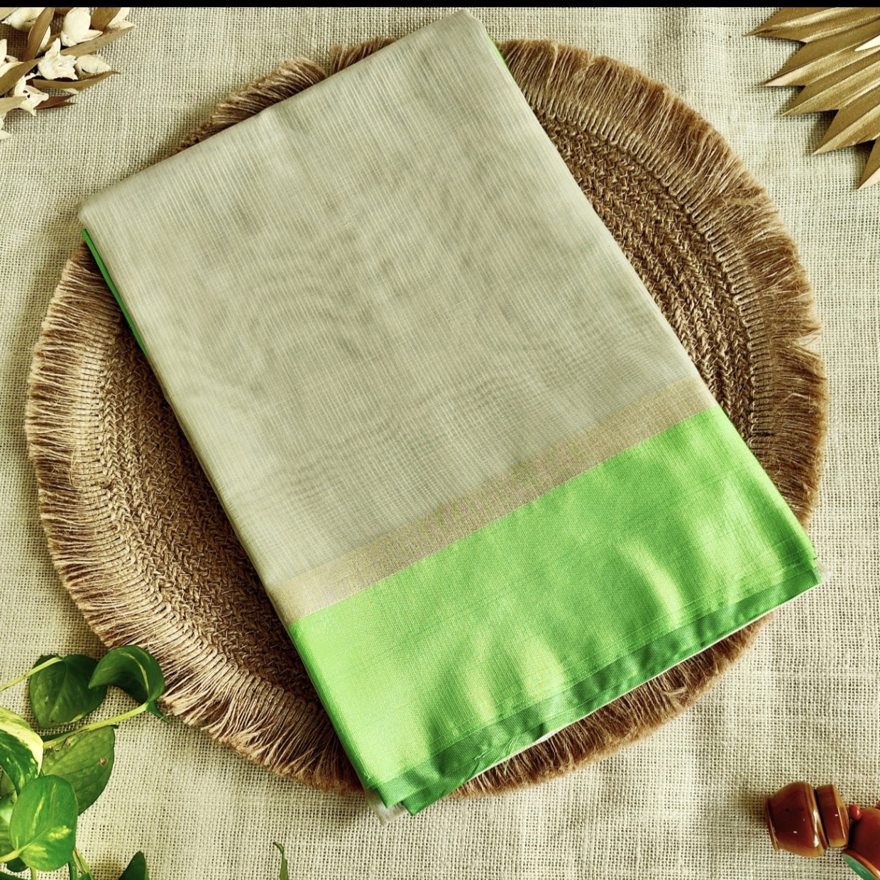 Ivory Tissue Parrot Green Border Saree